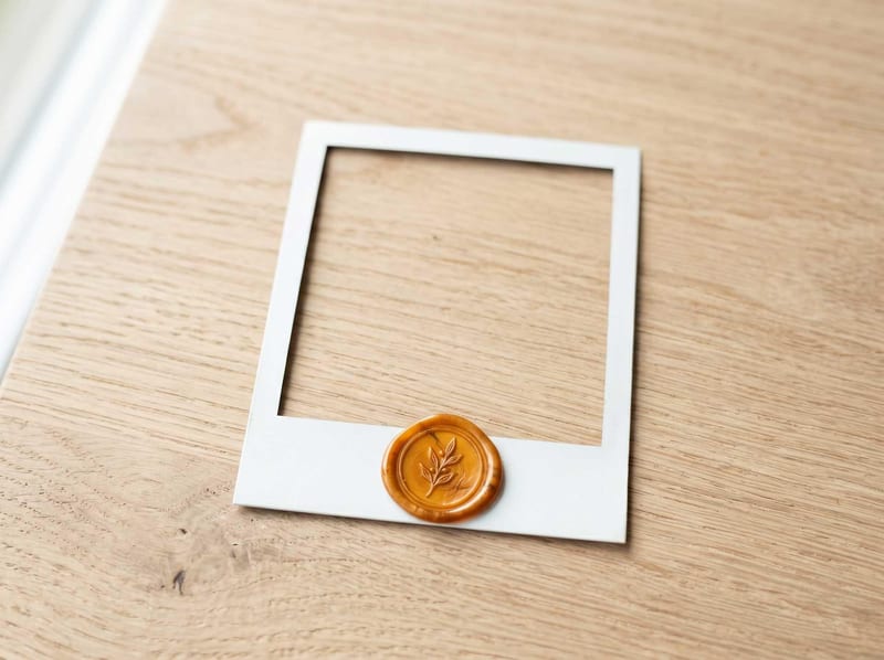 Polaroid frame with an amber wax seal, a reviewed connector example marker.