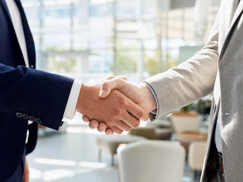 Owner and operator handshake confirming a connector access review is ready to begin.
